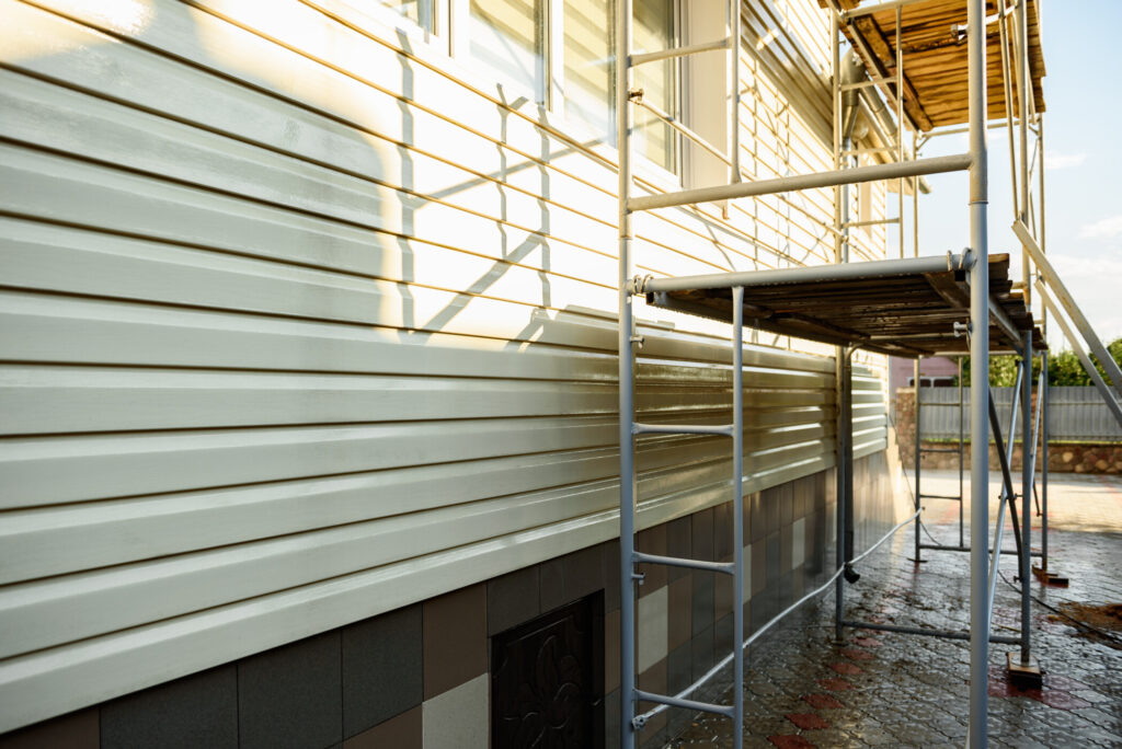 vinyl siding wall with a high-pressure washer.